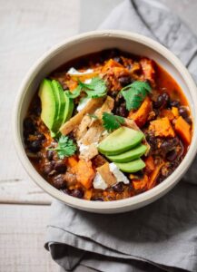 Vegetarian Sweet Potato and Black Bean Chili with Goat Cheese and Avocado