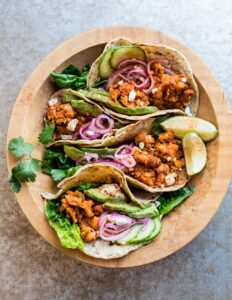 Soft corn tacos filled with smoky smashed chickpeas, pickled onions and avocado.Yum!