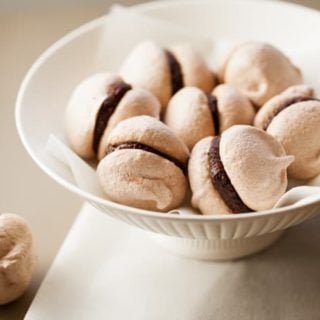 meringue cookies filled with chocolate and hazelnut