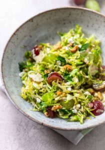 Shaved Brussels Sprouts Salad with Grapes, Feta and Walnuts