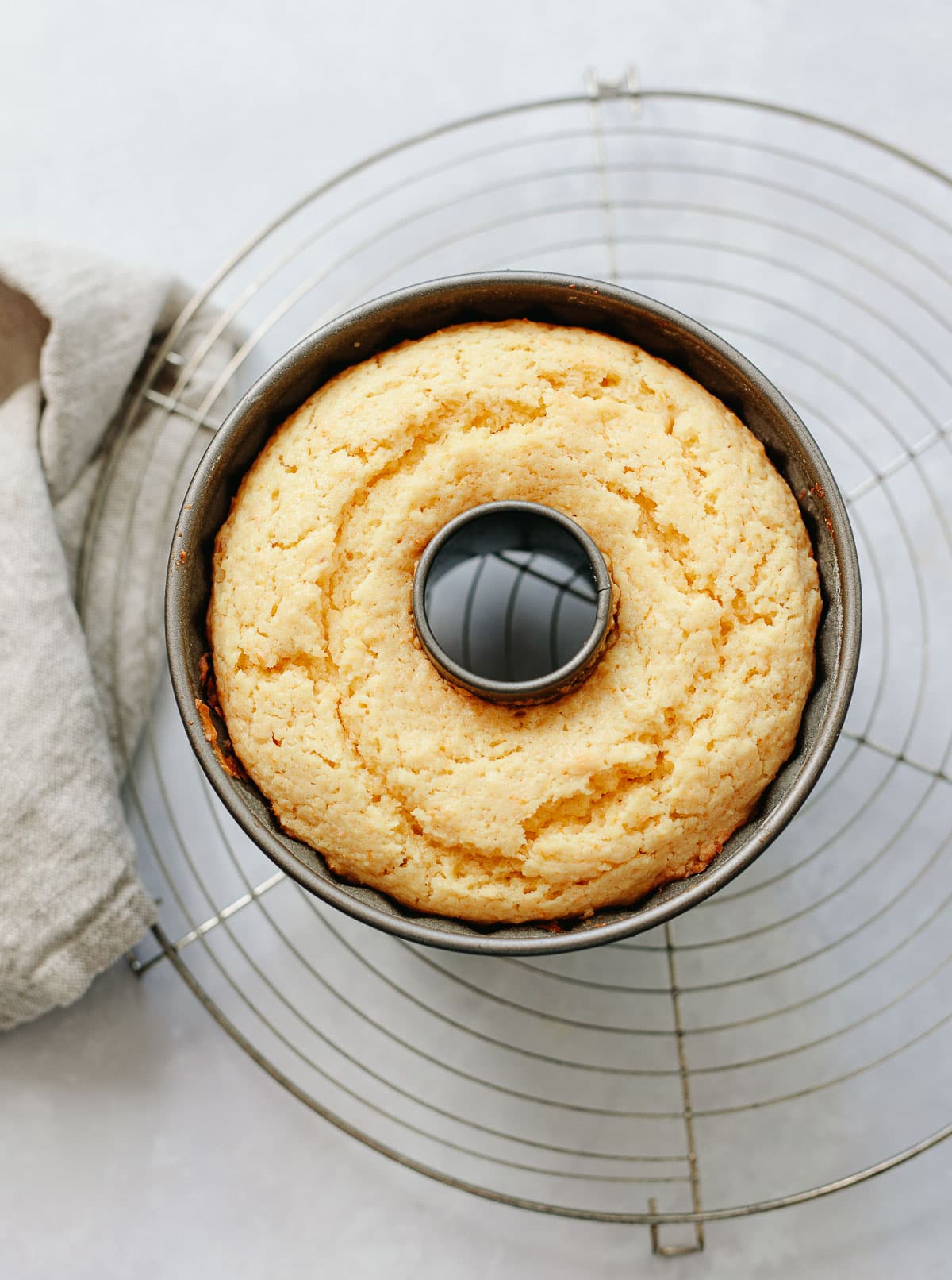 Whole lemon cake baked in a mini Bundt cake pan.