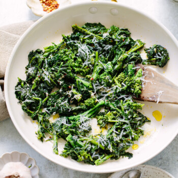 Olive oil and garlic sauteed broccoli rapini stems and florets in a skillet.